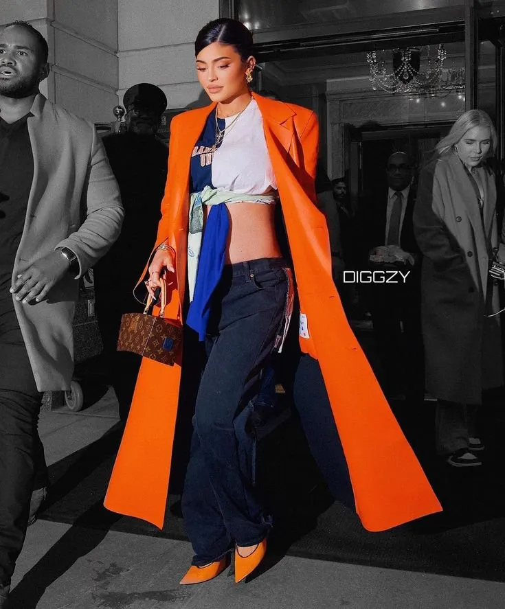 Kylie Jenner dazzles in an orange leather jacket for sale