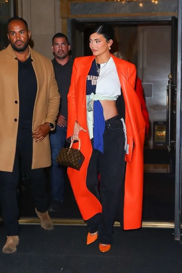 Kylie Jenner dazzles in an orange leather jacket